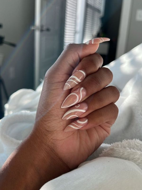 Nude-Nails-With-White-Swirls-for-a-Classy-Look